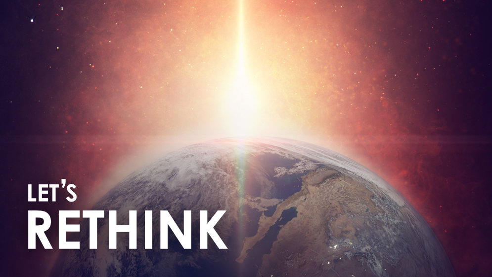 The earth seen from space with the sun coming over the horizon