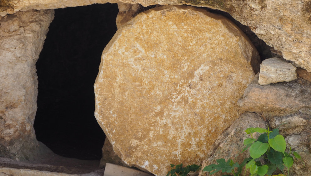 A tomb with the stone seal rolled back.