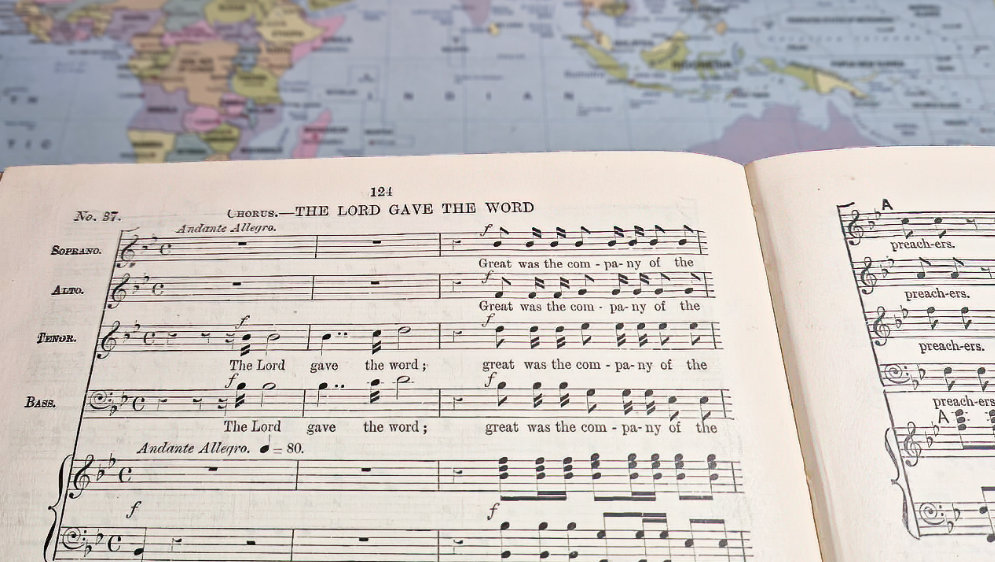 Music sheet over map.